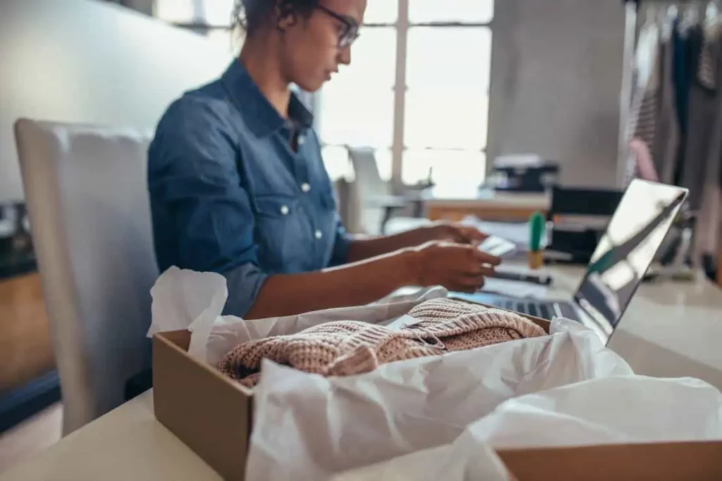 Business owner creating online listing for excess inventory.