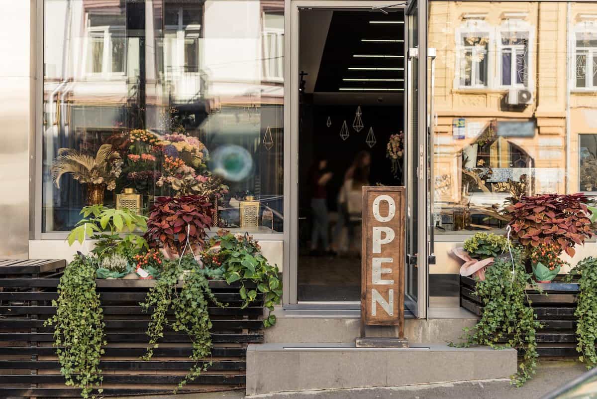 Coffee shop entrance with fresh flowers
