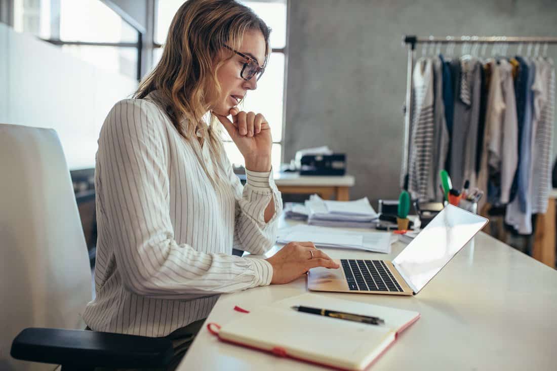Woman small business owner reviews finances